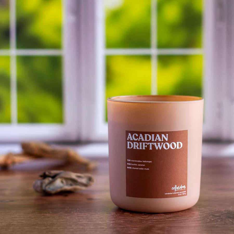 Cellar Door soy candles is hand poured into a reusable glass container using the highest quality, with an eco-friendly wood wick, these premium candles have a burn time of up to 80 hours. Scent Notes of bonfire, charred cedar, musk, marshmallow.