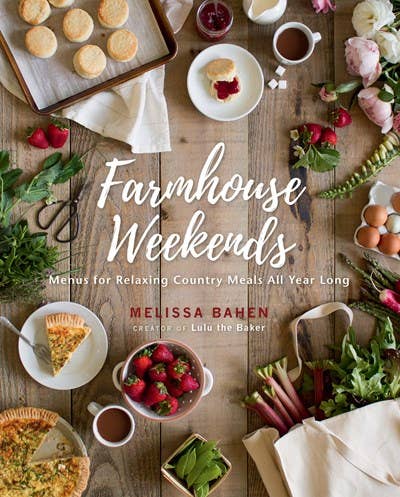 A rustic feast set on a wooden table, featuring fresh produce, homemade pies, and hot beverages, invitingly presented under the heading "Farmhouse Weekends with Melissa Bahen" with additional text indicating "Farmhouse Weekends: Menus for Relaxing Country Meals All Yr" by Gibbs Smith.